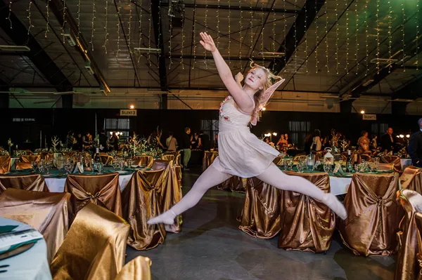 Dancer performing in the decorated event hall at Paint the Town PINK