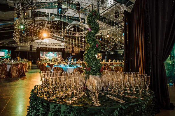 Candlelit tables beneath hanging greenery at Paint the Town PINK