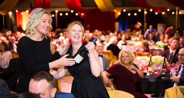 Guests enjoying dinner together at Paint the Town PINK