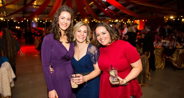 Three guests posing together at Paint the Town PINK