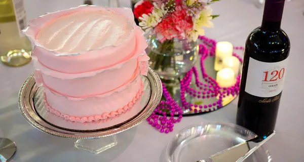 Pink cake on a dessert table at Paint the Town PINK
