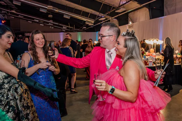Guests talking during the reception at Paint the Town PINK